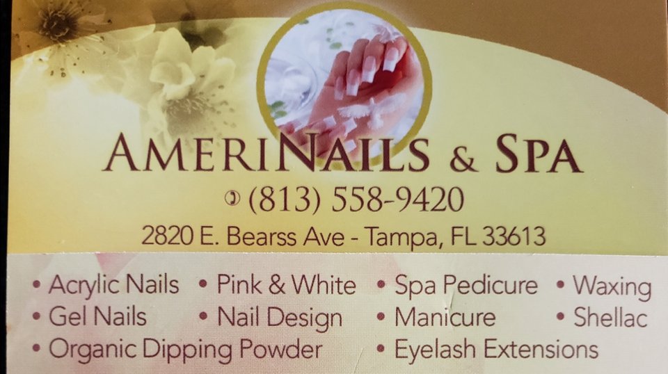 Nail technician shaping acrylic nails at a salon station.