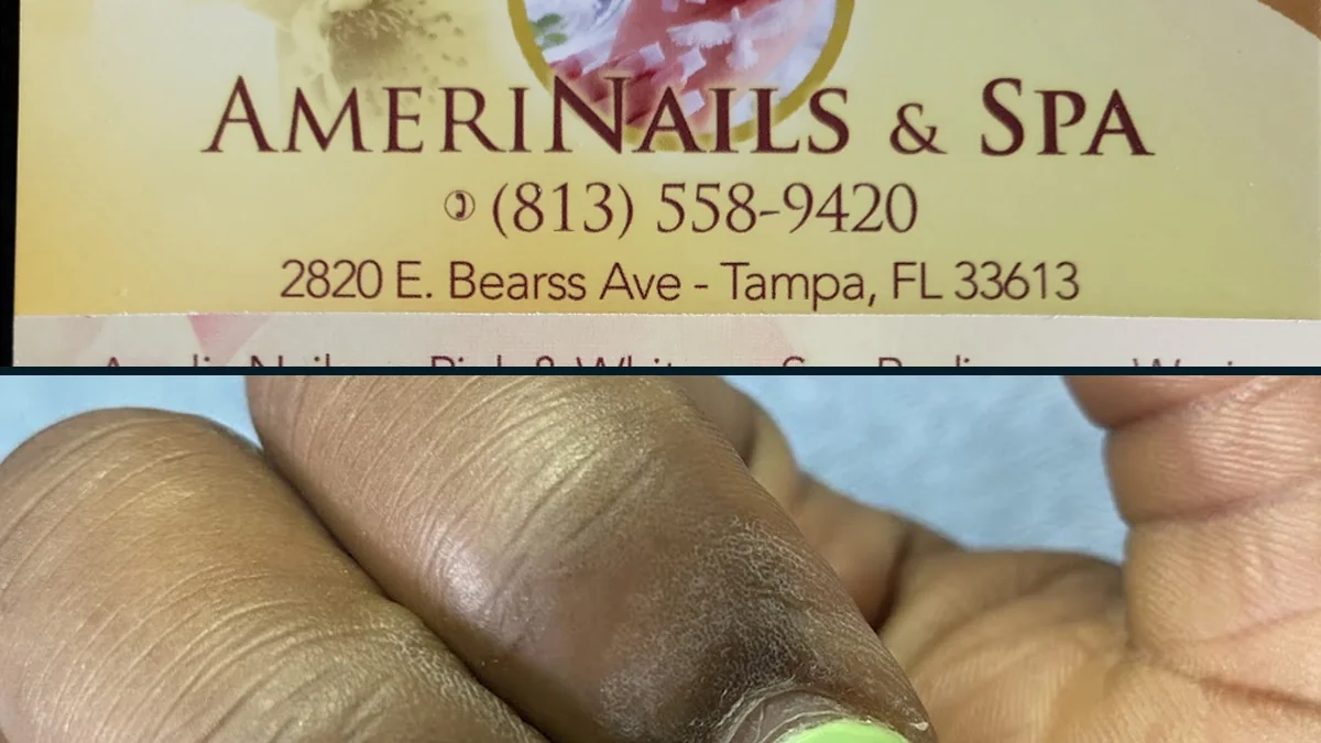 Nail technician shaping acrylic nails at a salon station.